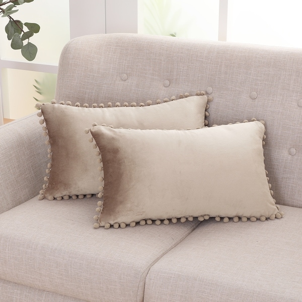 White pillows with deals pom poms