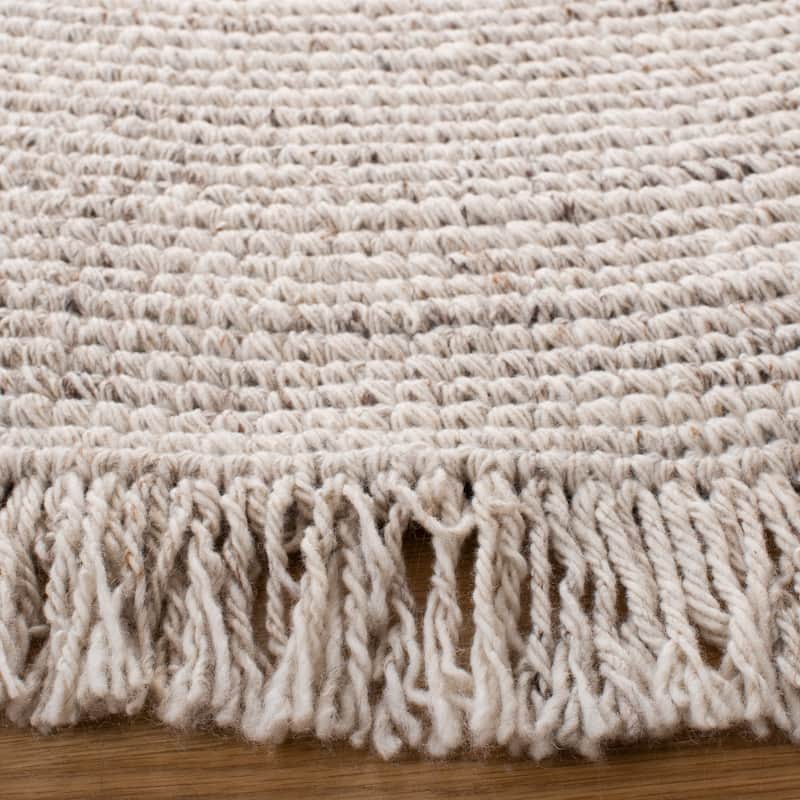 SAFAVIEH Handmade Braided Pelagia Fringe Round Rug