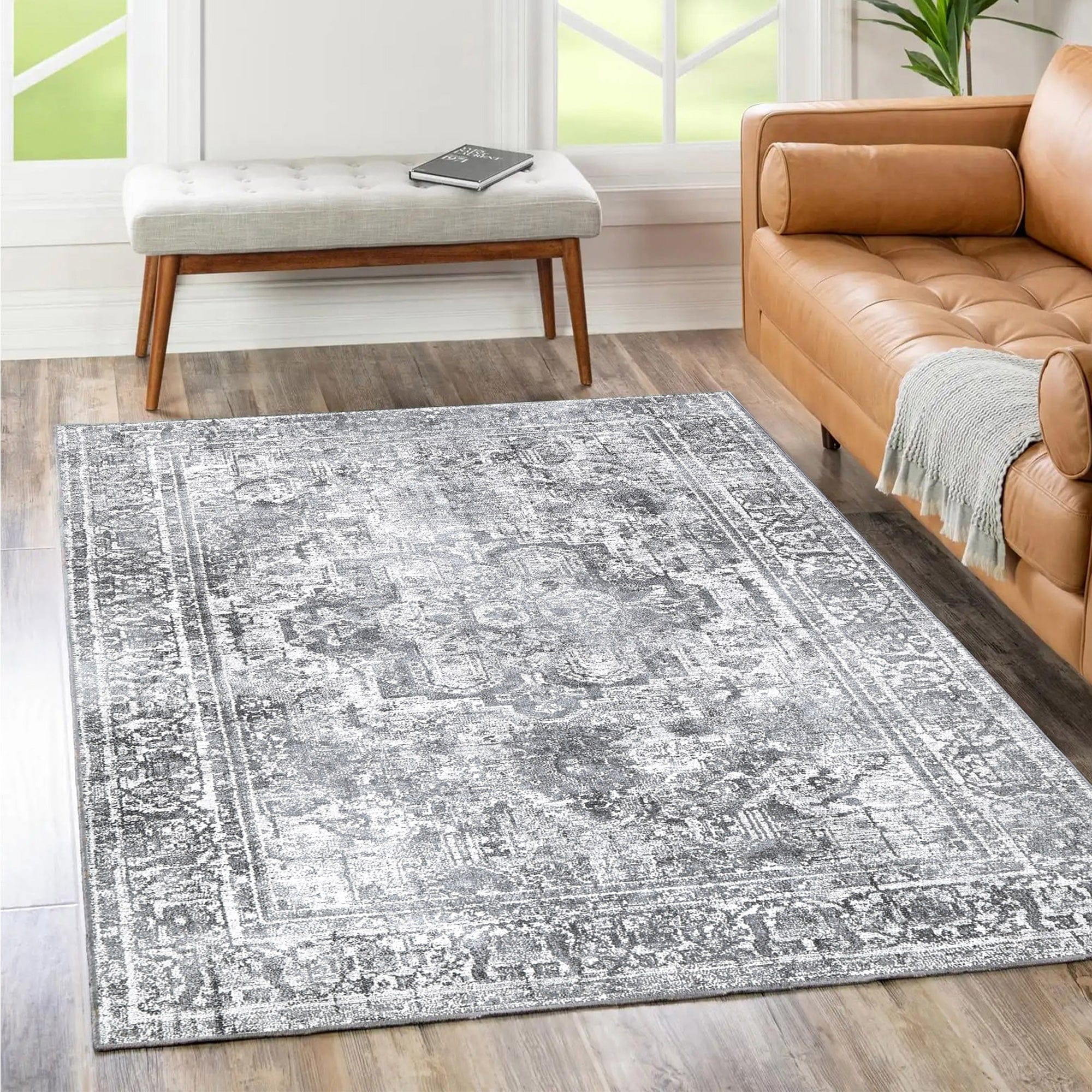 https://ak1.ostkcdn.com/images/products/is/images/direct/426f0c091c15e1cf8fb15b62733201fdeb294942/The-Rug-Collective-Distressed-Vintage-Chilaz-Grey-Rug-Machine-Washable-Area-Rug.jpg