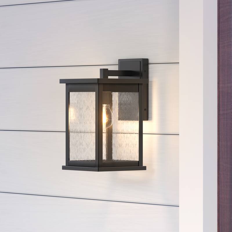 Millennium Lighting Bowton 1 Light Outdoor Wall Sconce in Powder Coat Black with Clear Glass Shade