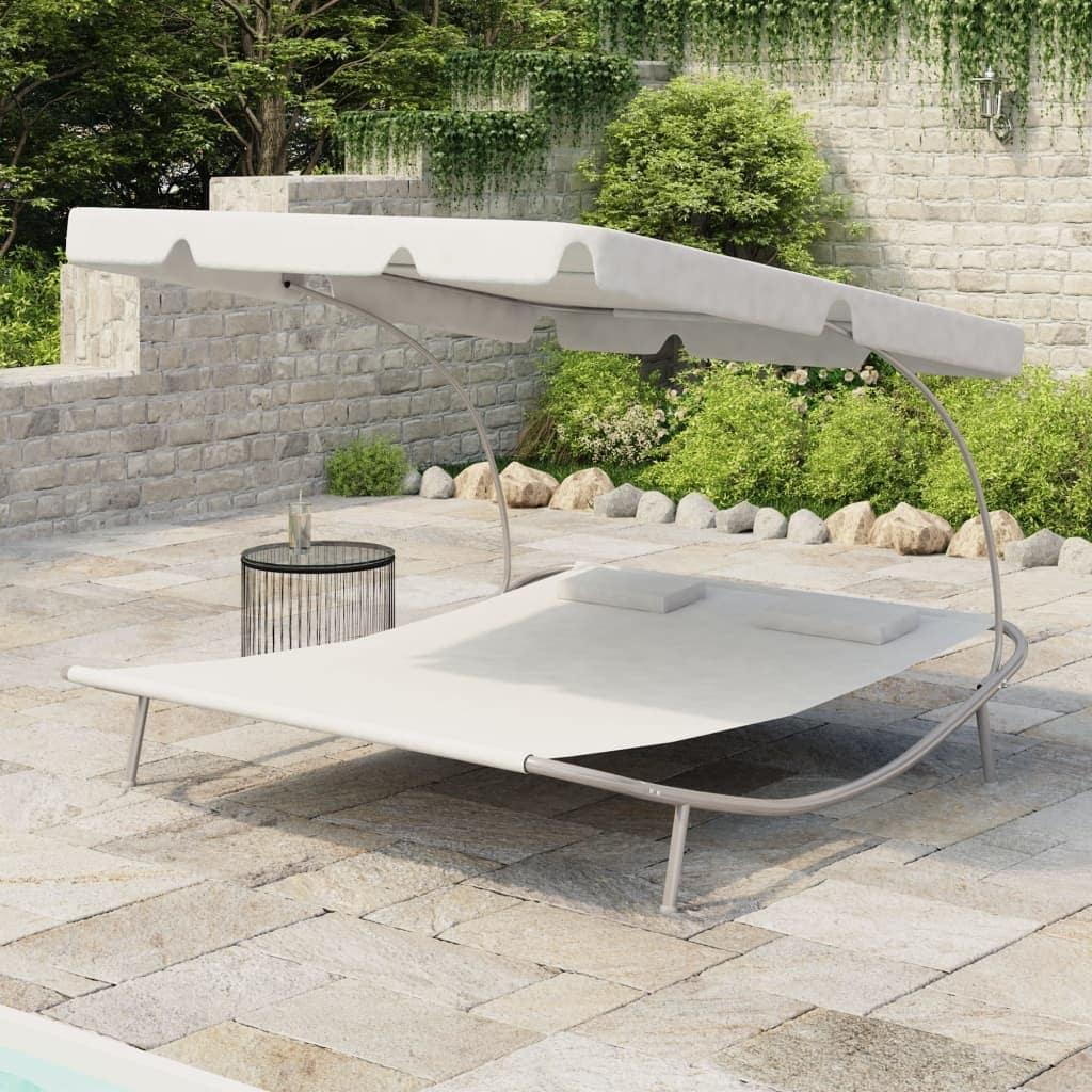 Outdoor lounge bed with on sale canopy and pillows
