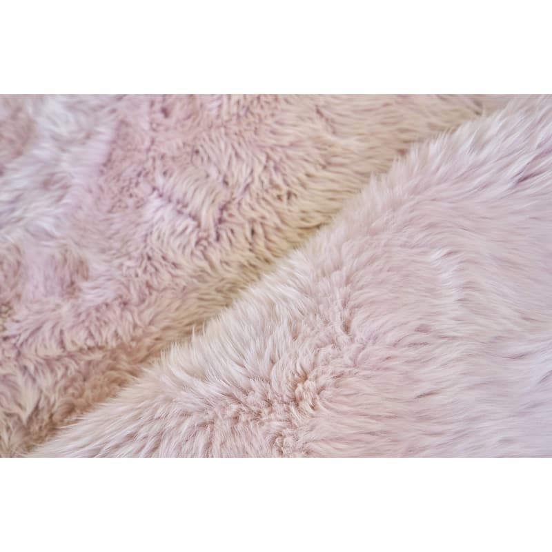 EXQUISITE RUGS Sheepskin Hand-stitched Blush Area Rug.