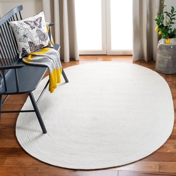 https://ak1.ostkcdn.com/images/products/is/images/direct/4396af663698cc799d528c148cd311202ee164cf/SAFAVIEH-Handmade-Braided-Arja-Country-Wool-Rug.jpg?impolicy=medium
