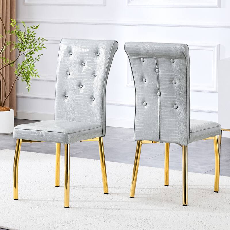 A set of 2 vintage crocodile leather cushioned dining chairs, featuring crystal clasp design and artificial leather design