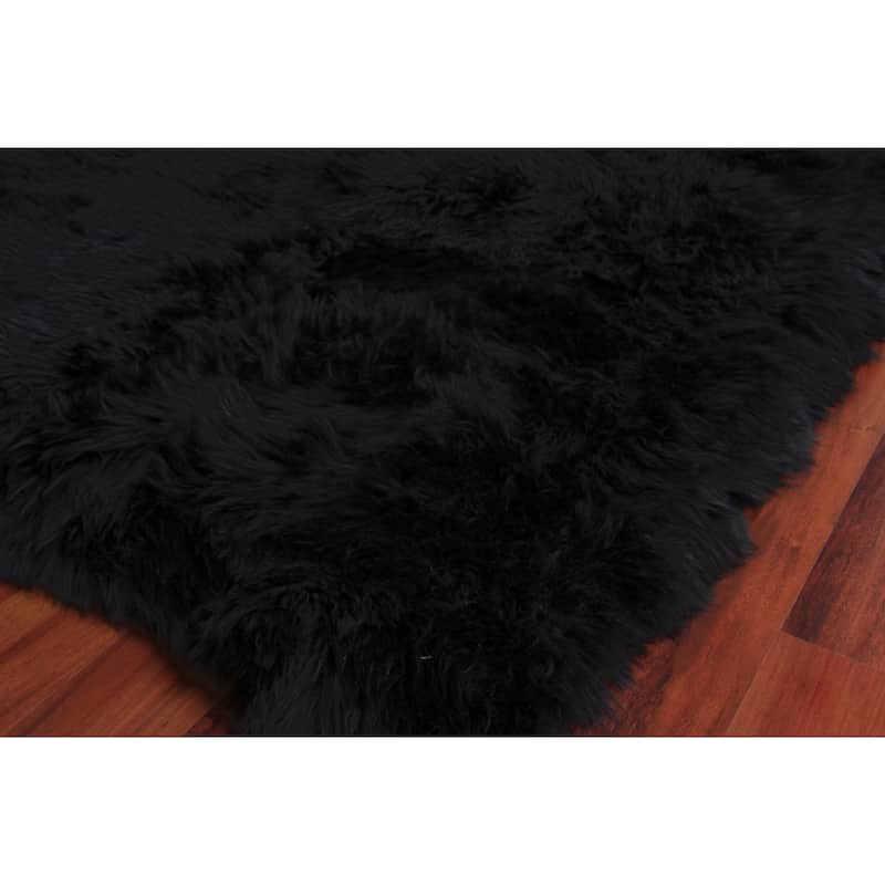 EXQUISITE RUGS Sheepskin Hand-stitched Black Area Rug.