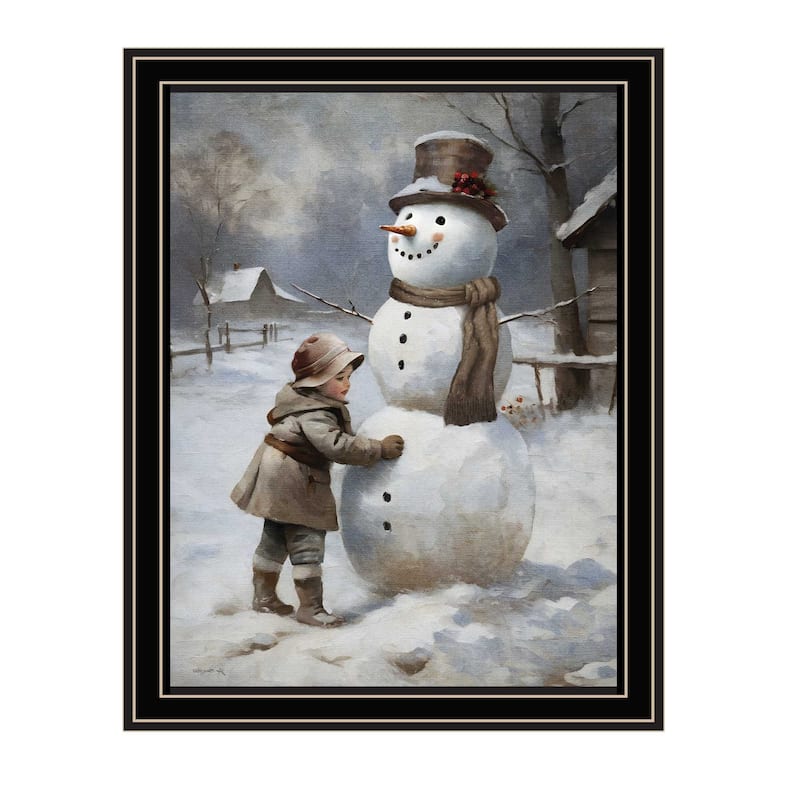 HomeRoots Boy Building A Snowman Black Framed Wall Art
