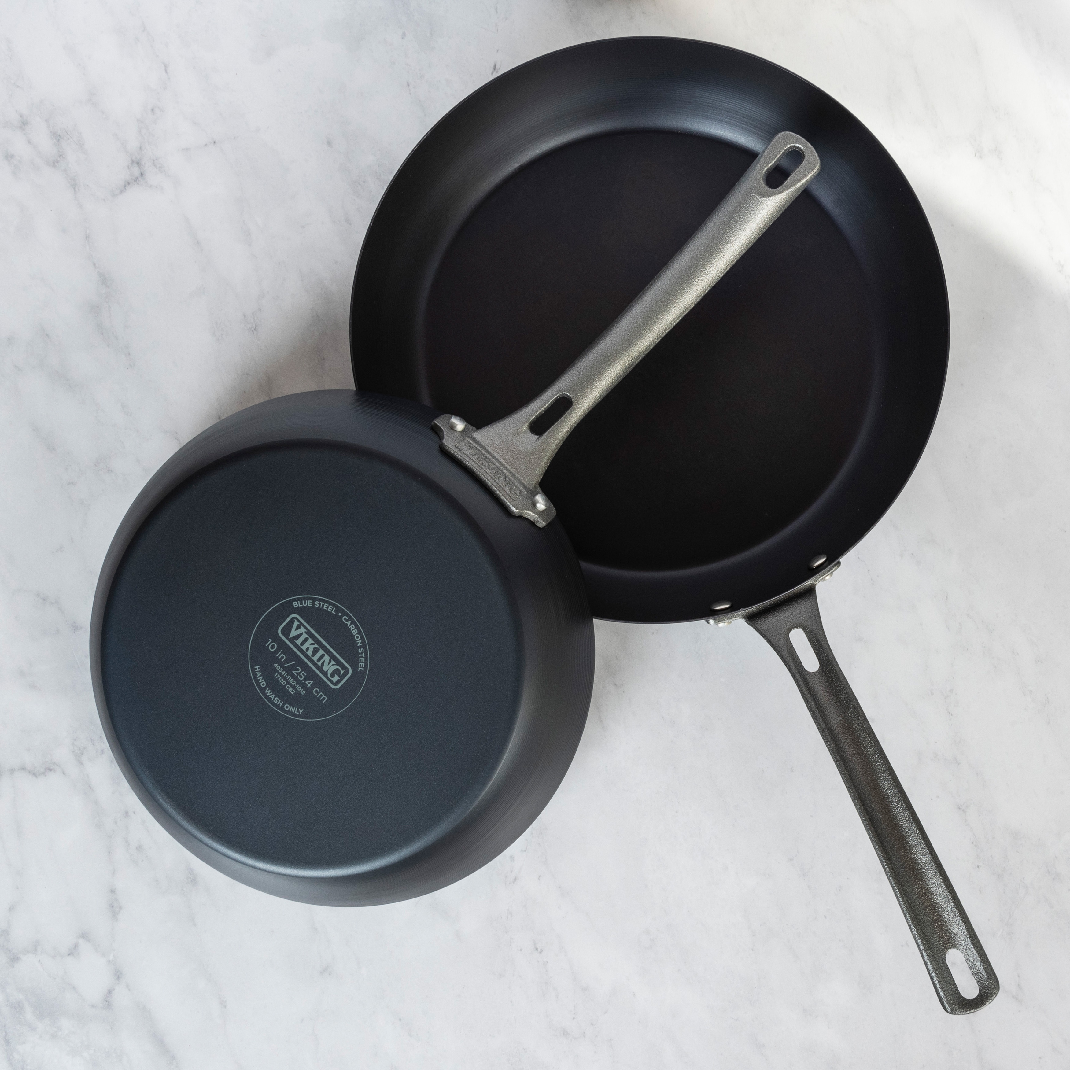 https://ak1.ostkcdn.com/images/products/is/images/direct/441446c993e0807a837150d0be8bb191531ea292/Viking-2-Piece-Blue-Carbon-Steel-Fry-Pan-Set.jpg