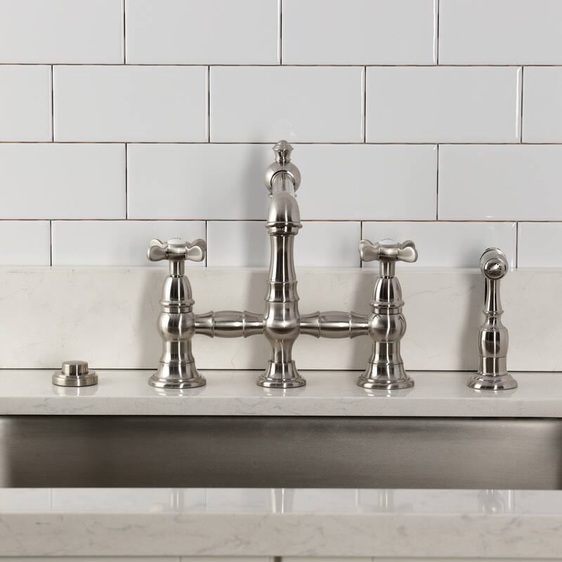 Kingston Brass Essex Two-Handle 4-Hole Deck Mount Bridge Kitchen Faucet with Brass Side Sprayer