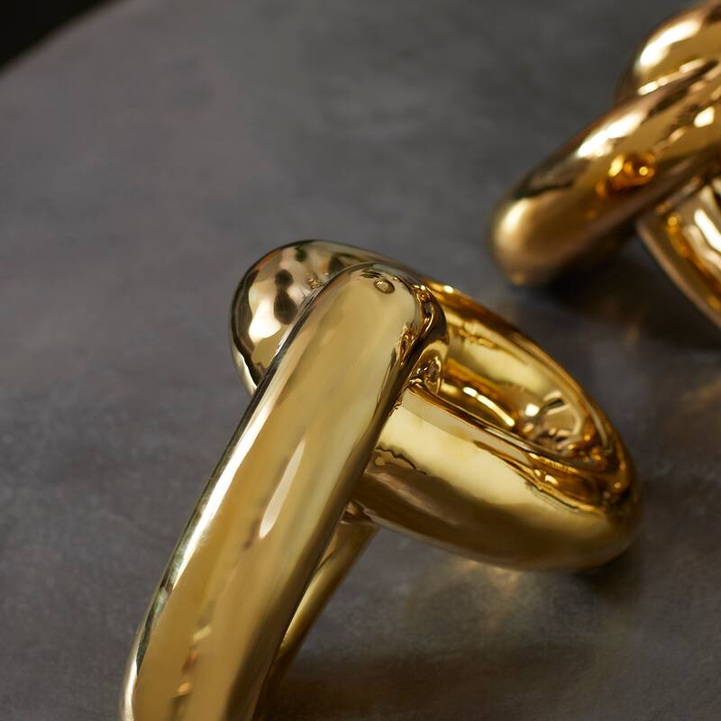 CosmoLiving by Cosmopolitan Gold Porcelain Ceramic Chain Decorative Sculpture (Set of 2)