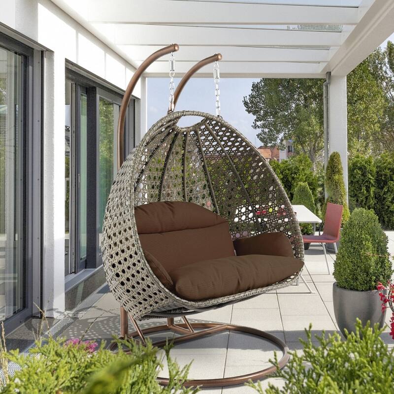LeisureMod Modern 2-Person Egg Hanging Swing Chair with Beige Wicker, Oxford Fabric Cover, Patio Hammock Lounger and Cushions