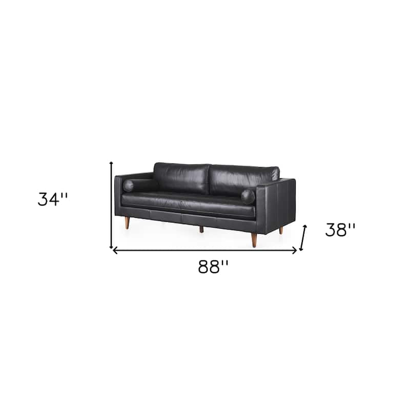 HomeRoots 88" Black Leather Sofa And Toss Pillows With Brown Legs