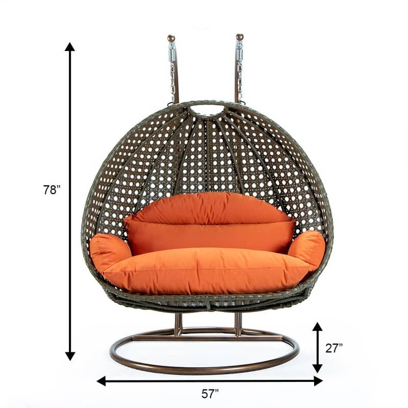 LeisureMod 2-Person Hanging Egg Swing Chair with Metal Stand - Handcrafted Beige Wicker, Patio Hammock Lounger with Cushions