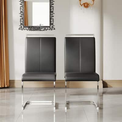 A set of 4 artificial leather dining chairs