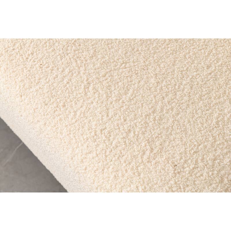 Luxurious and comfortable upholstered sofa with golden legs and pillows for living room and reception area