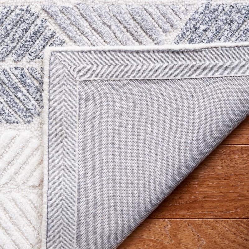 SAFAVIEH Handmade Ebony Sidonie Modern Wool Rug