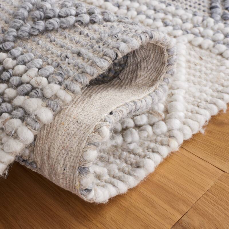 SAFAVIEH Handmade Natura Gerdje Wool Braided Tassel Rug