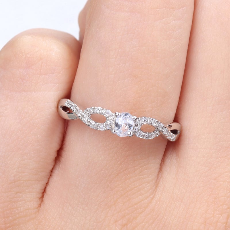 Miadora 1/10ct TDW Diamond and Created White Sapphire Infinity Engagement Ring in Sterling Silver