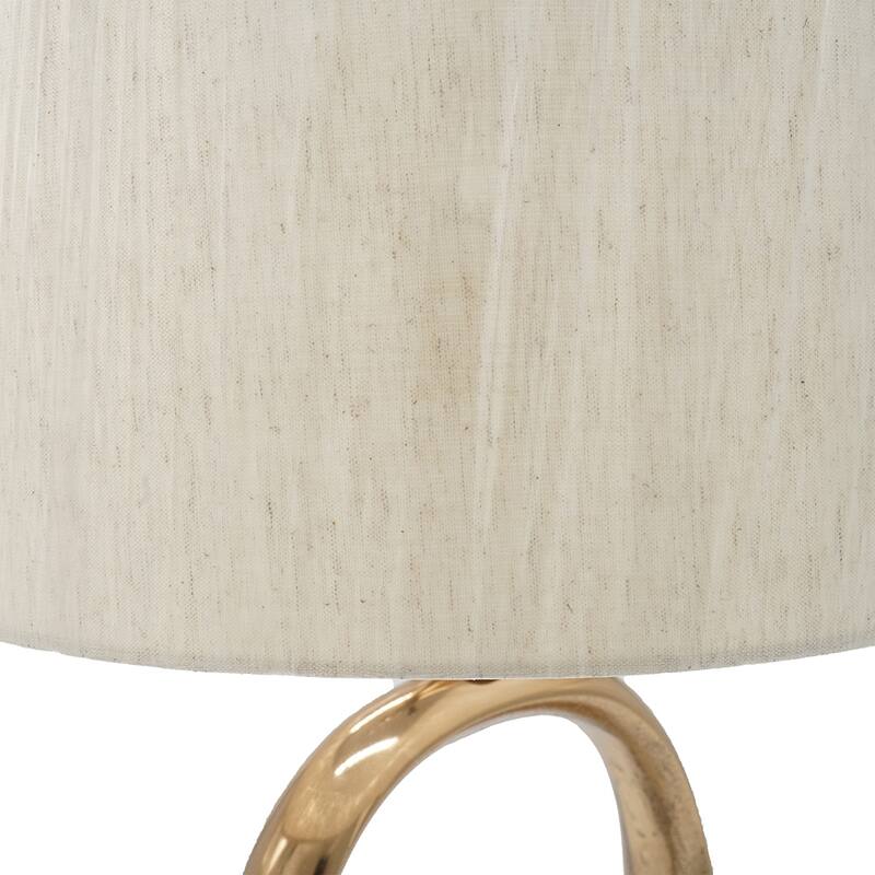 Oval Shape Cut Out Metal Table Lamp with Cream Linen Shade