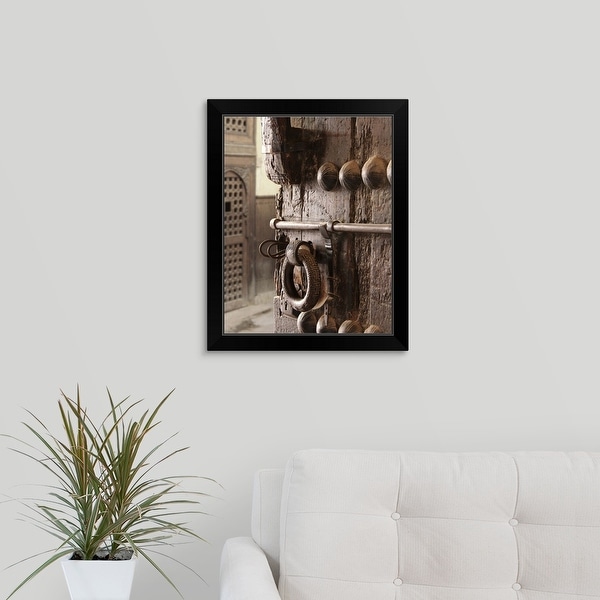 "Rustic, heavy, ornate wooden door" Black Framed Print