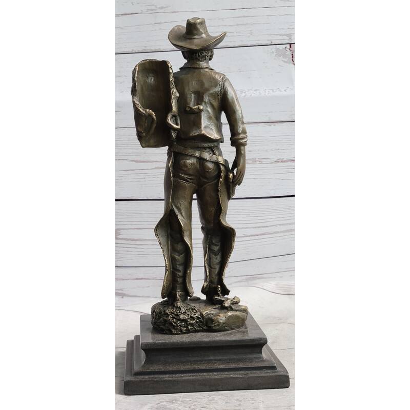 Country Western Cowboy In Chaps Carrying Imitative Horse Saddle Bronze Statue Sculpture Figure 12 Inches X 4 Inches