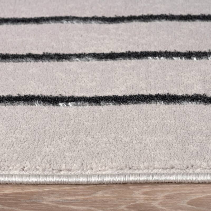 Elegant Area Rug with Carved Lines and Arch Pattern