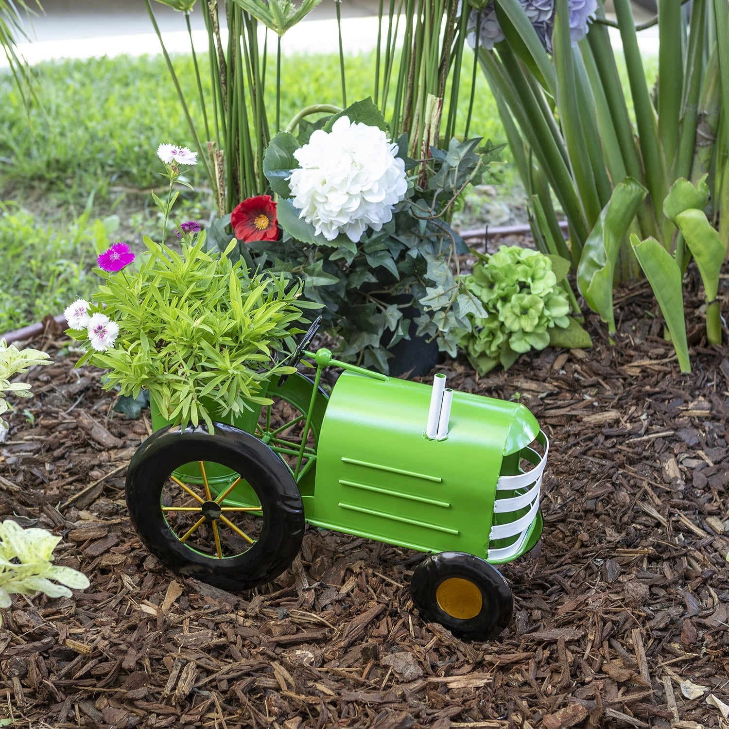 Image of Green tractor flower planter with sign