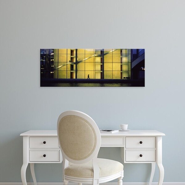 Easy Art Prints Panoramic Image 'Person walking in front of a building, Paul Lobe Haus, Berlin, Germany' Canvas Art