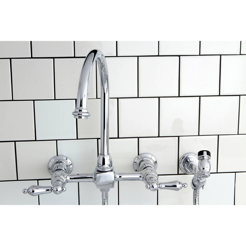 Kingston Brass Restoration Wall Mount Bridge Kitchen Faucet with Brass Sprayer