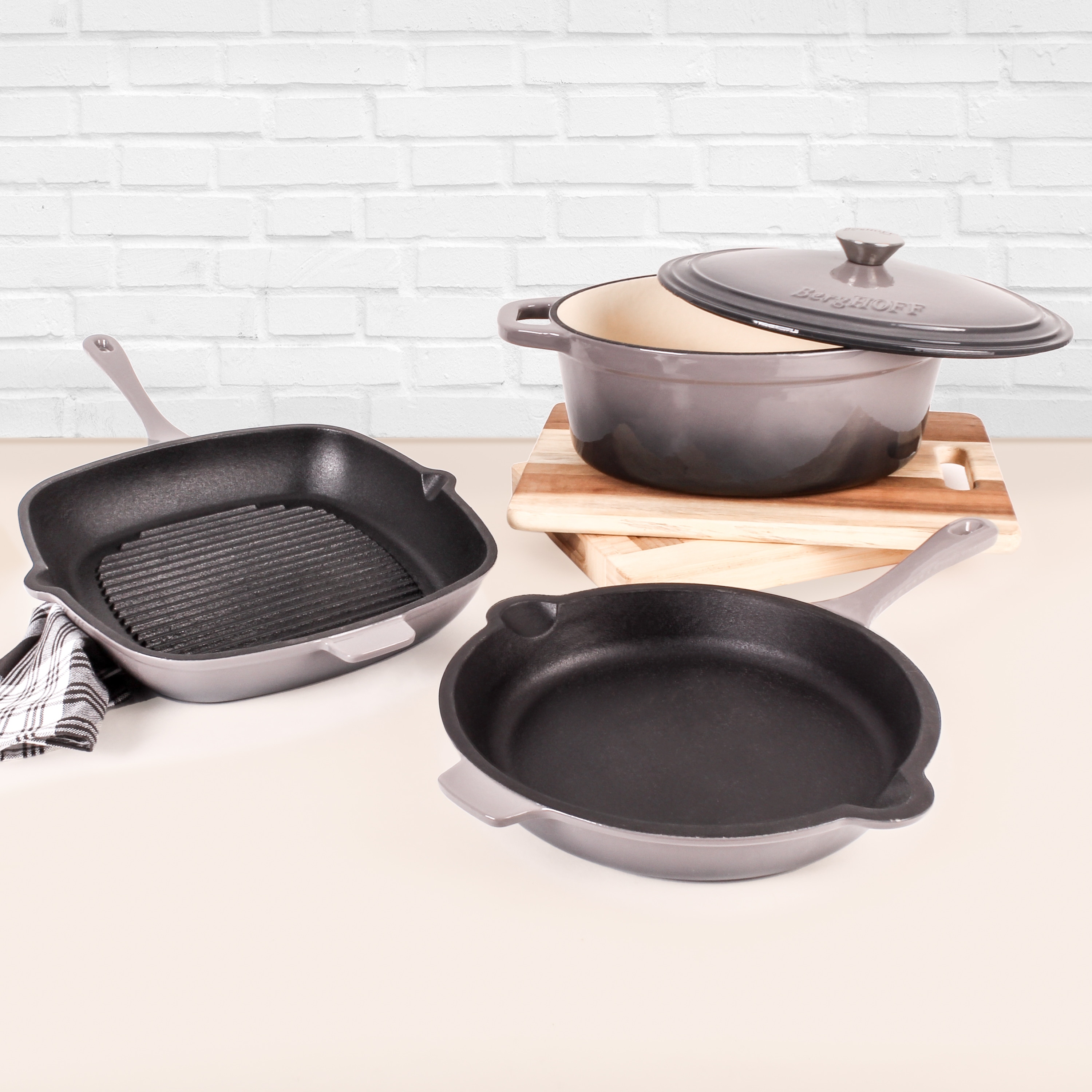 https://ak1.ostkcdn.com/images/products/is/images/direct/4b7114f1e2ca4a511d5bb7376608b38c09f2bd79/Neo-Cast-Iron-4pc-Set-F-P-G-P-%26-5-Qt-Cov-Dutch-Oven-Oyster.jpg