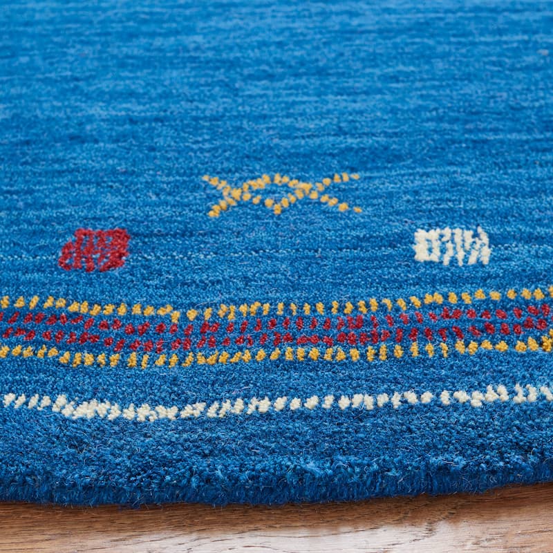 SAFAVIEH Handmade Himalaya Breann Border Wool Rug