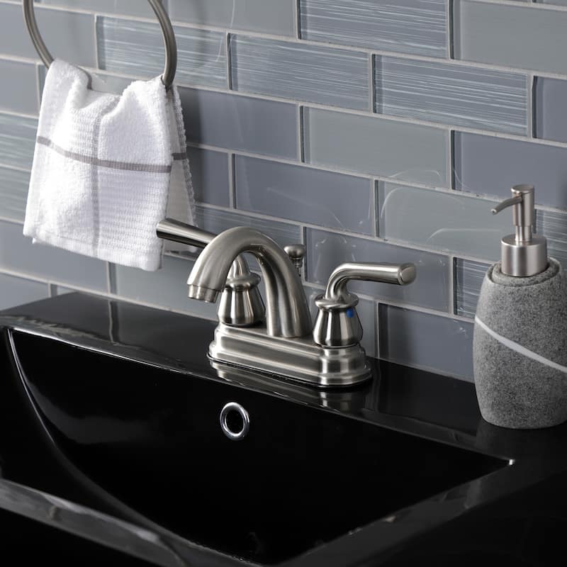 Kingston Brass Restoration Two-Handle 3-Hole Deck Mount 4" Centerset Bathroom Faucet with Plastic Pop-Up