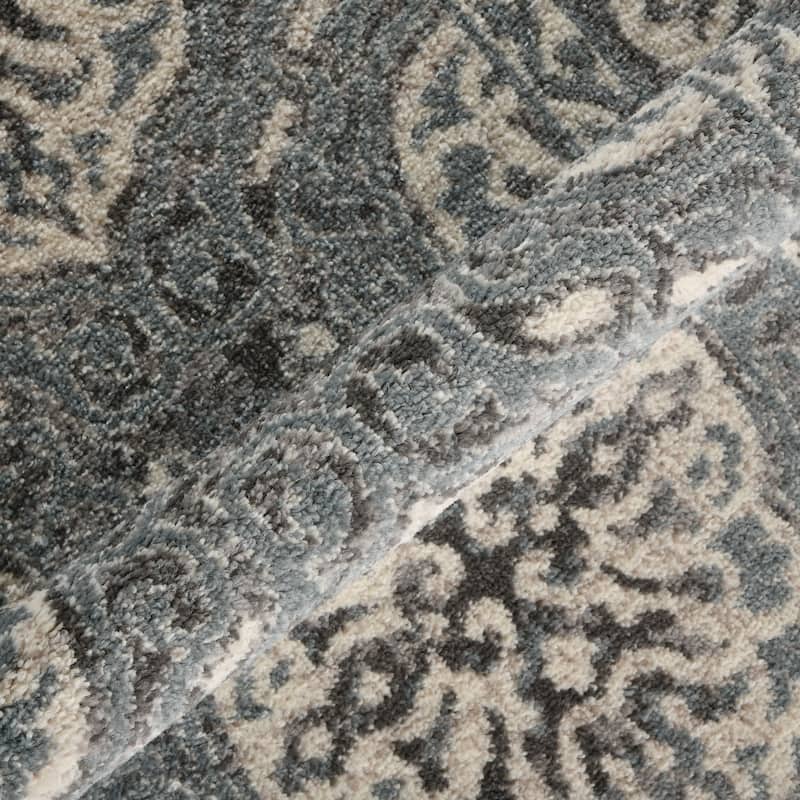 Aurelia Sina Bordered Area Rug