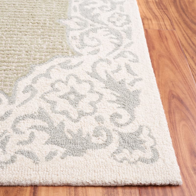 SAFAVIEH Handmade Ebony Snaedis Floral Wool Rug