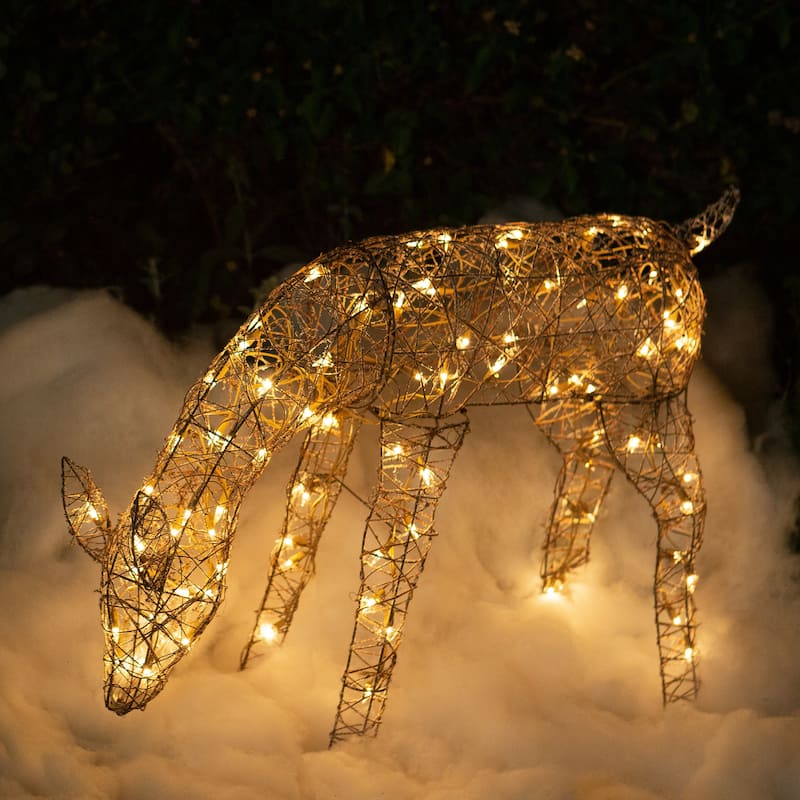 Alpine Corporation Outdoor Rattan Grazing Christmas Reindeer Lawn Decoration with White Halogen Lights