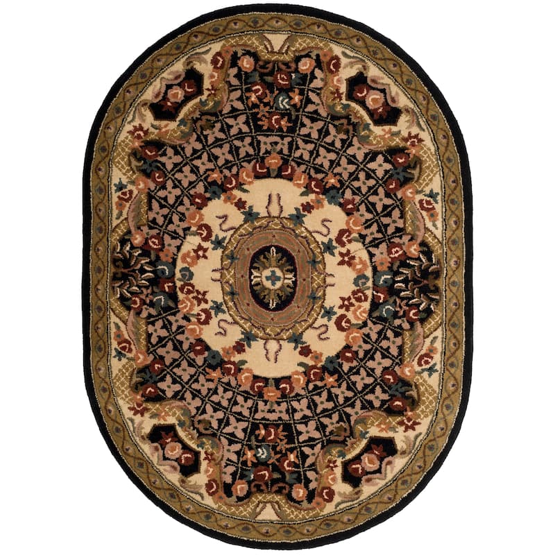 SAFAVIEH Handmade Classic Traiana Traditional Oriental Wool Rug - 7'6" x 9'6" Oval - Black/Gold