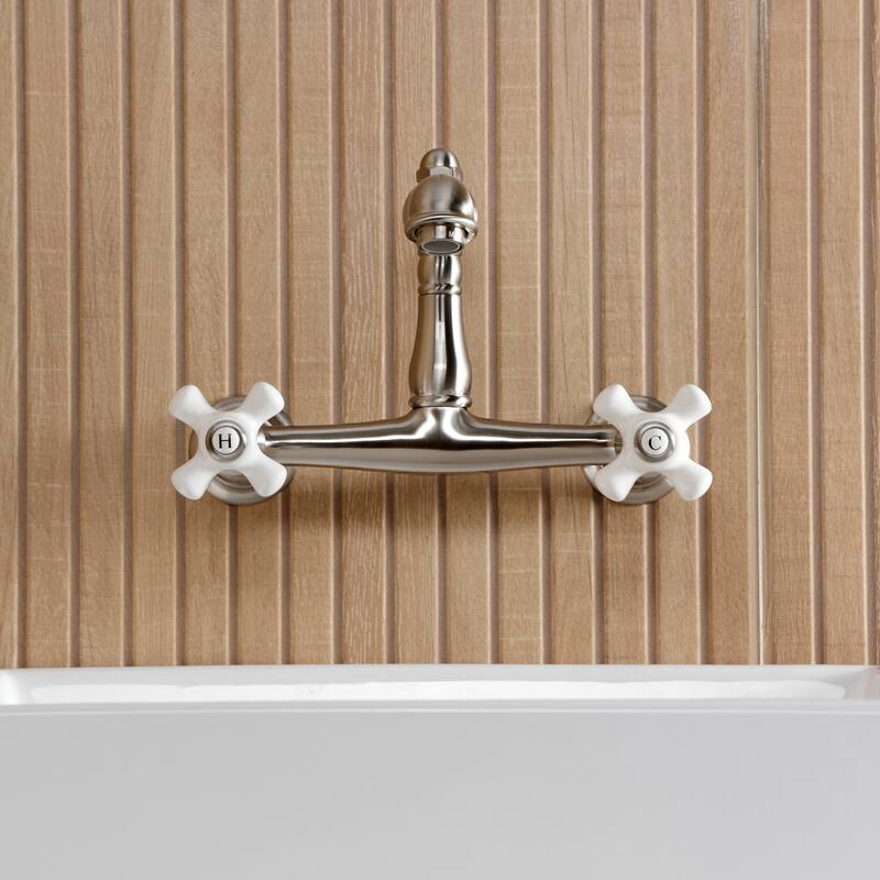 Kingston Brass English Country Two-Handle 2-Hole Wall Mount Bathroom Faucet