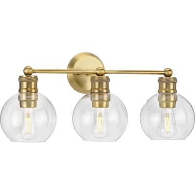 Hansford Collection Three-Light Vintage Brass Clear Glass Farmhouse Bath Vanity Light - 24.5 in x 7.25 in x 10.87 in
