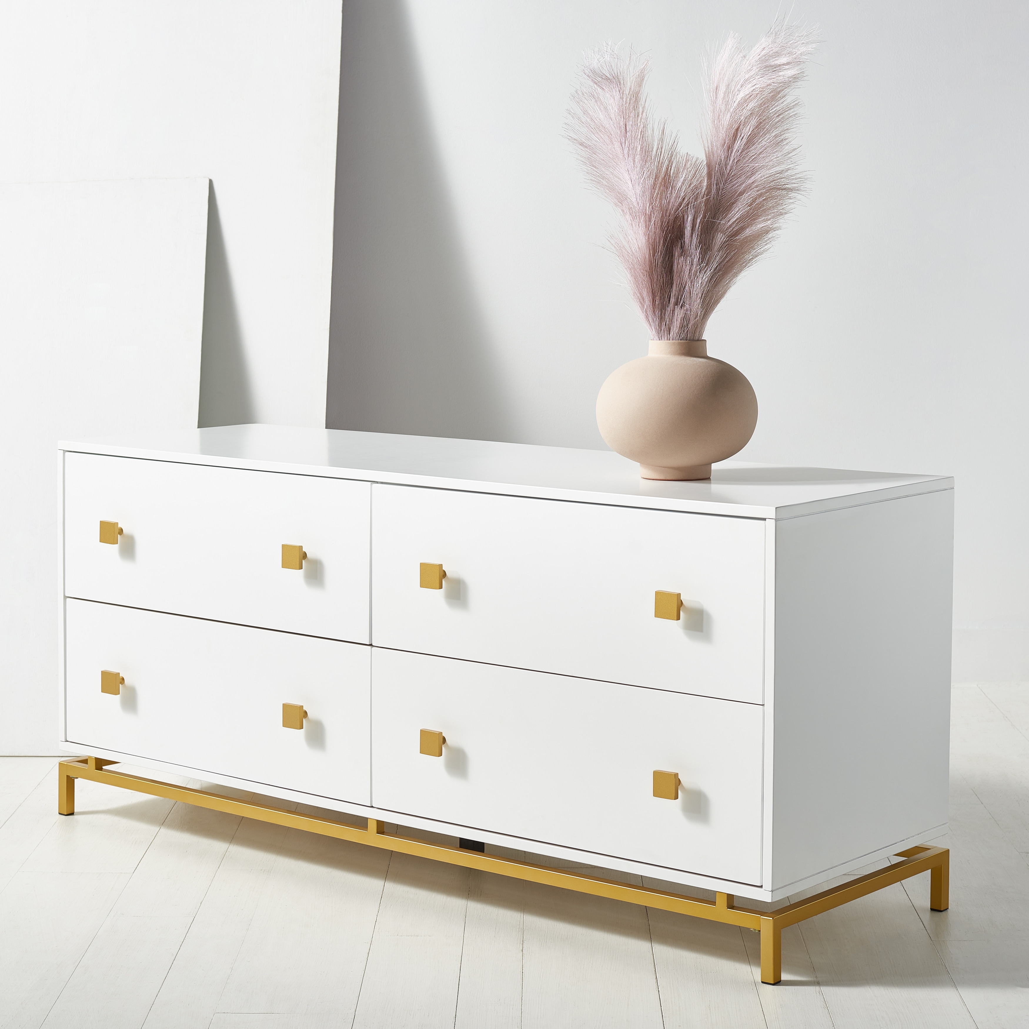 White dresser deals with gold accents