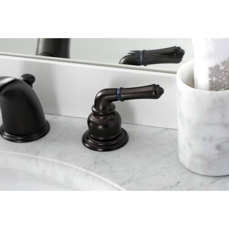 Kingston Brass Magellan Deck Mount Widespread Bathroom Faucet with Brass Pop-Up