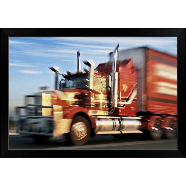 "Blurred big rig truck on highway" Black Framed Print