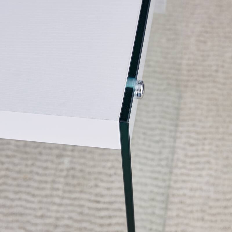 The top of the coffee table is made of MDF and white stickers, and the sides are clear tempered glass. The design is sim
