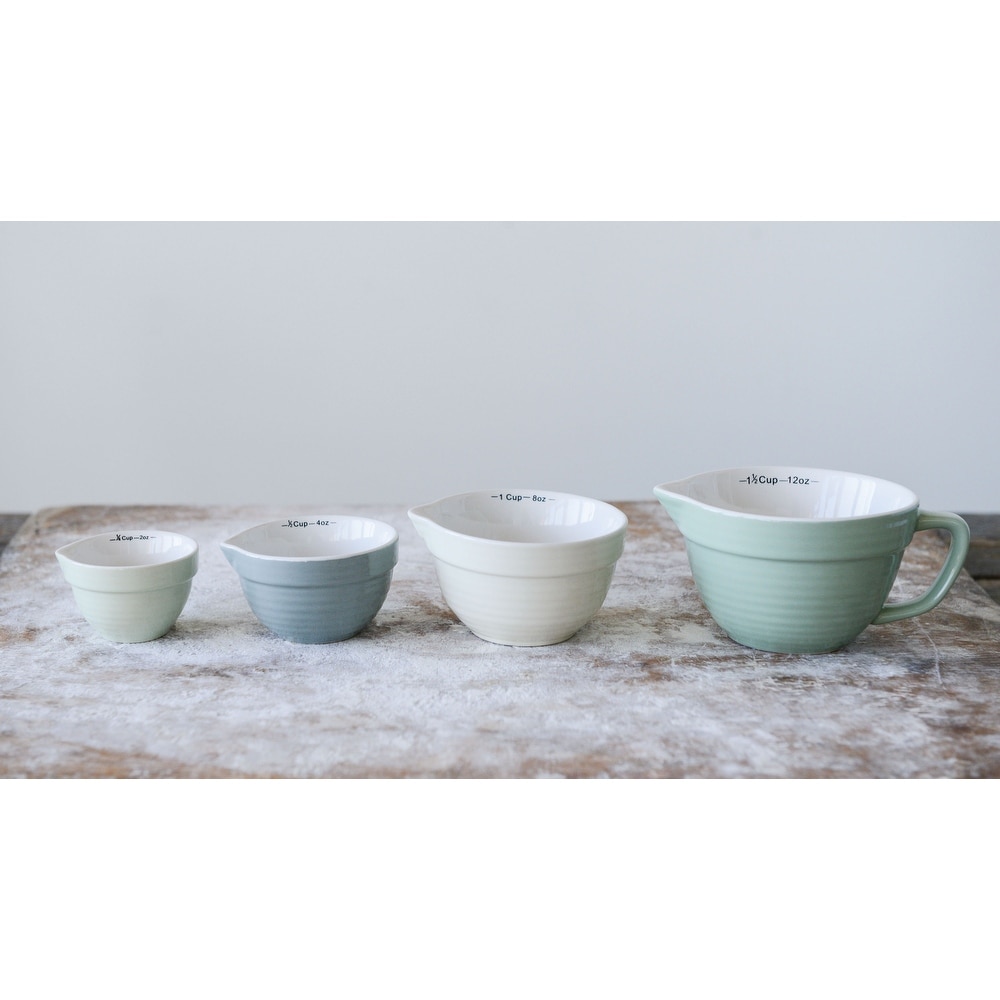 https://ak1.ostkcdn.com/images/products/is/images/direct/4f8e6ca0e6c5f7292677330c2dfb1901fc7c4f00/Batter-Bowl-Shaped-Measuring-Cups-%28Set-of-4-Sizes%29.jpg