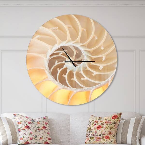 slide 2 of 10, Designart 'Golden Nautilus Shell Pattern' Oversized Coastal Wall CLock