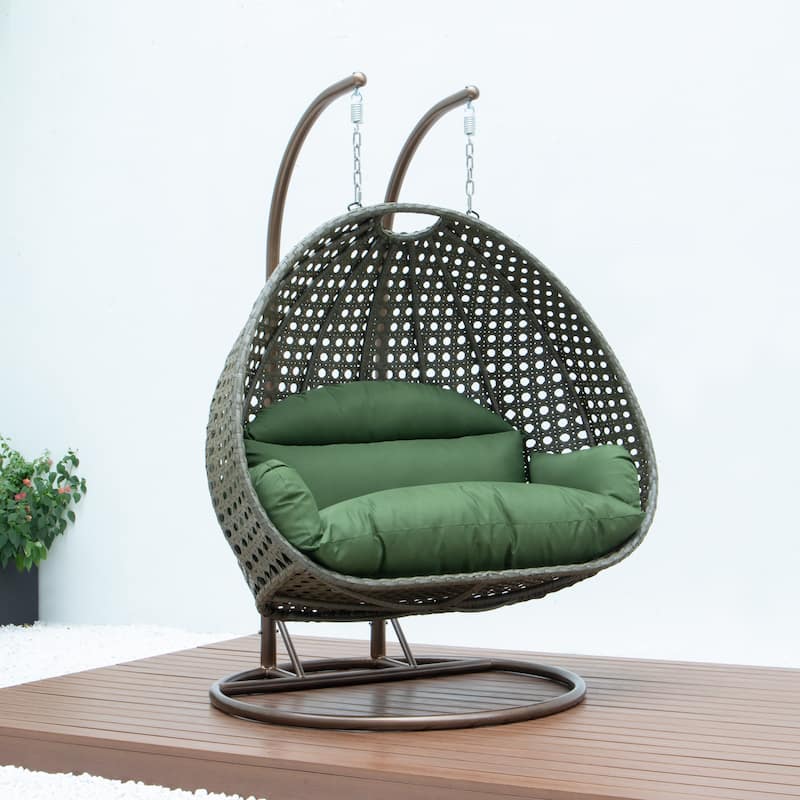 LeisureMod 2-Person Hanging Egg Swing Chair with Metal Stand - Handcrafted Beige Wicker, Patio Hammock Lounger with Cushions