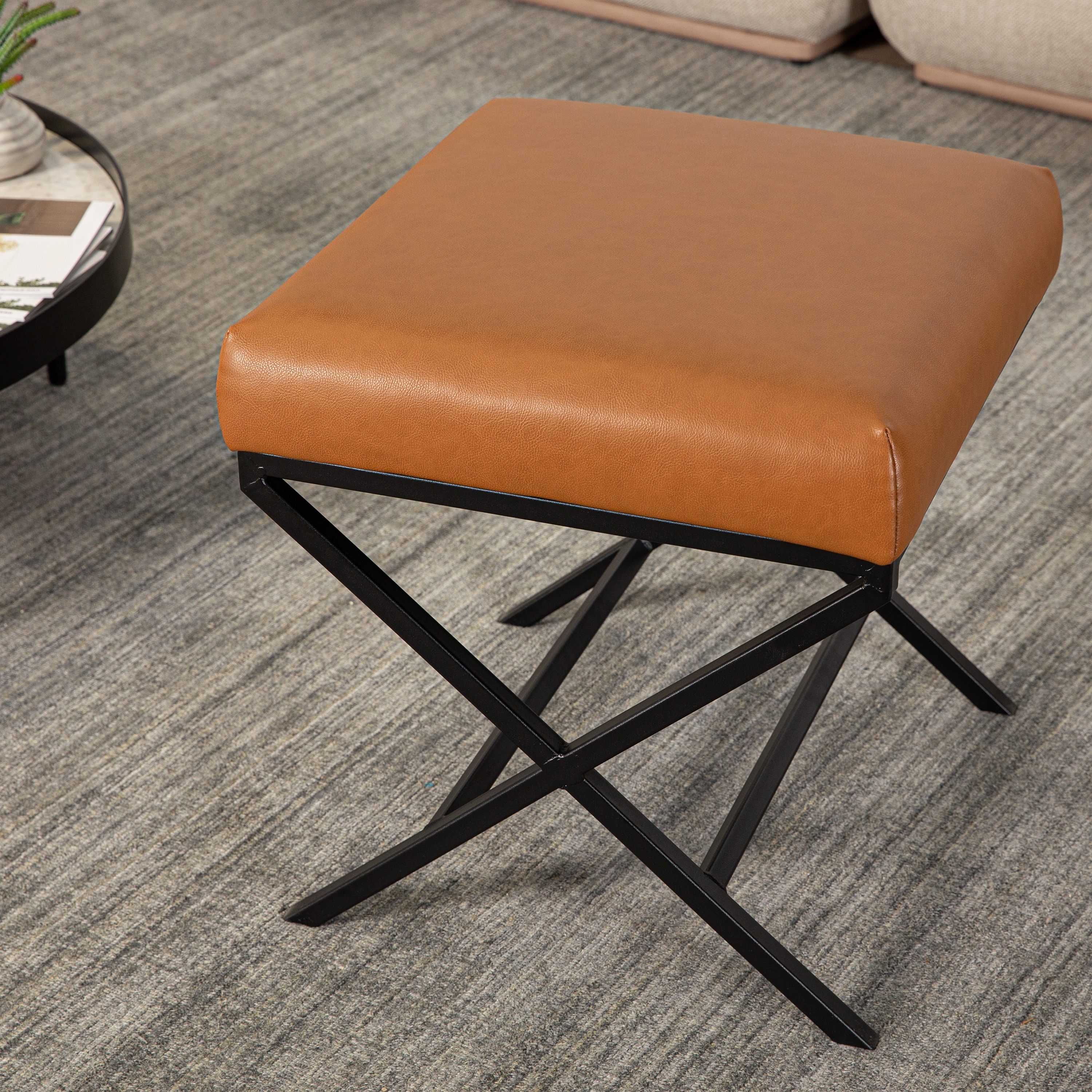 Leather ottoman store with metal base