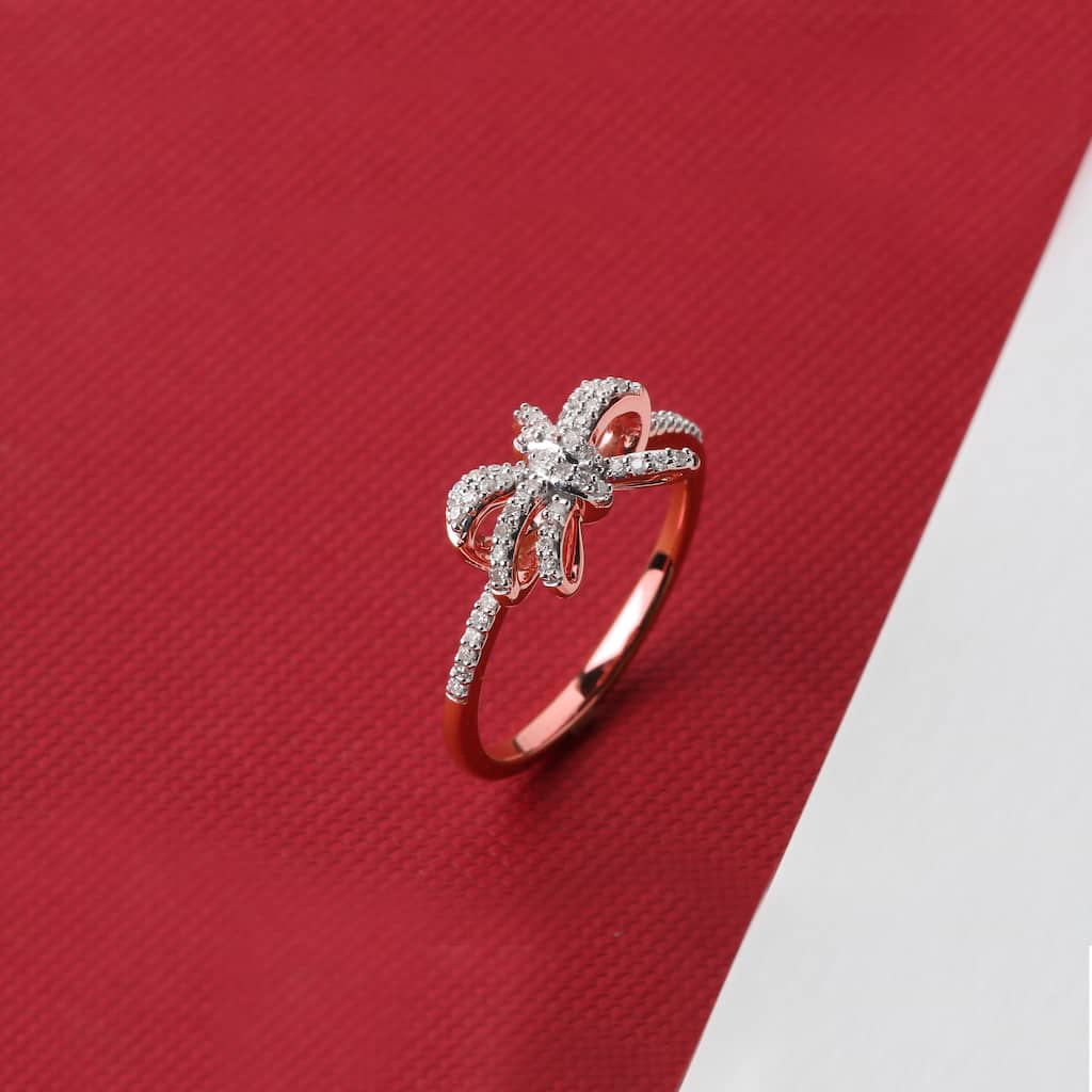 1/6ct TDW Diamond Knot Bow Fashion Ring in 10K Gold for Women