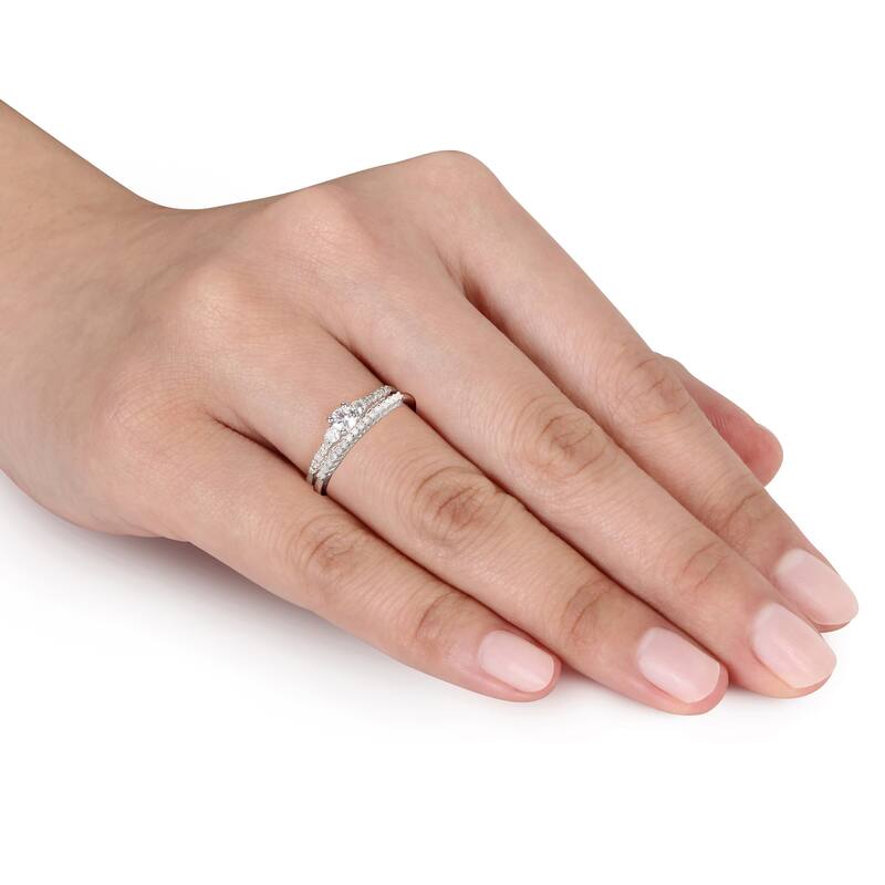 Miadora Sterling Silver Created White Sapphire and 1/10ct TDW Diamond 3-Stone Wedding Ring Set