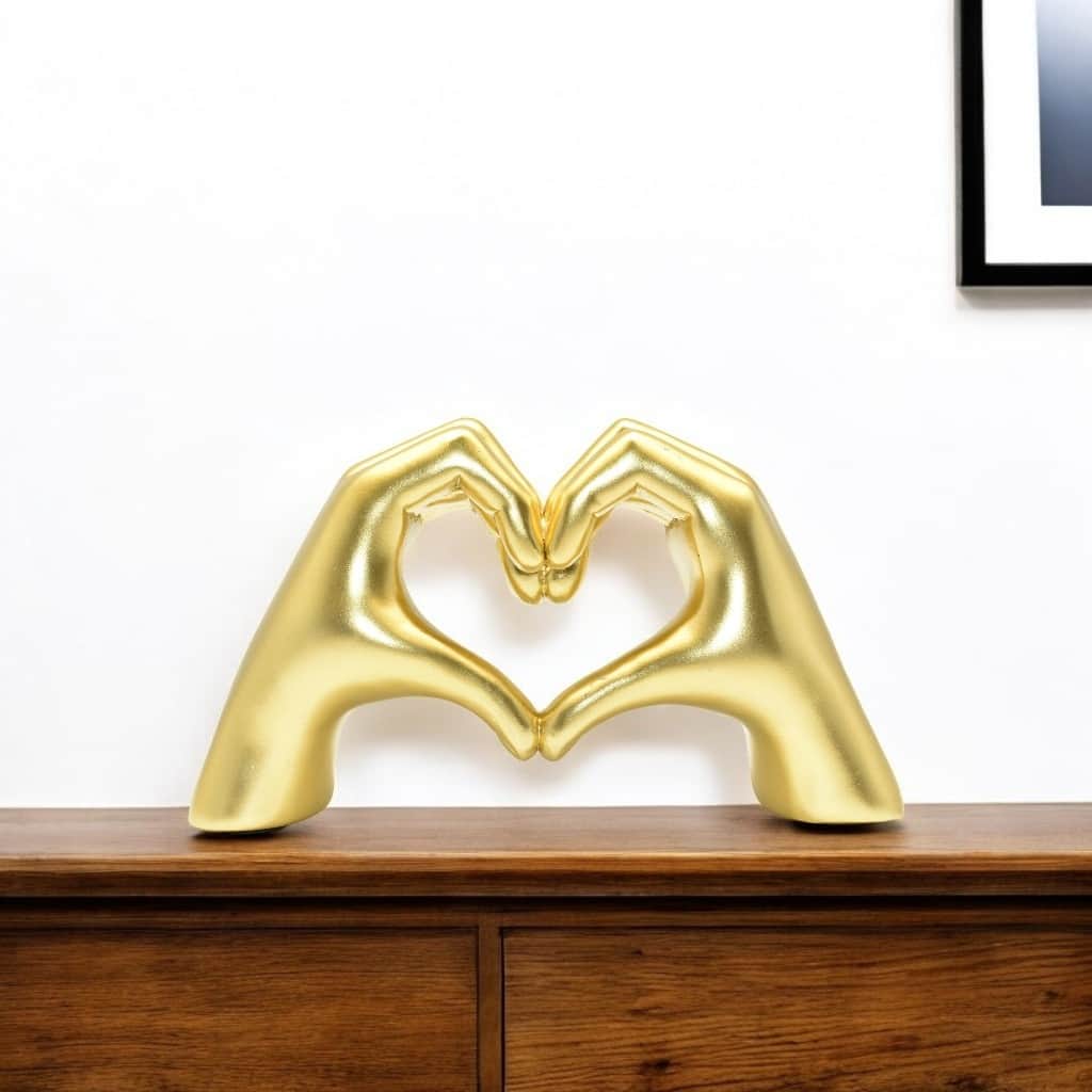 HomeRoots 4" Gold Resin Heart Hands Tabletop Sculpture - 5.5 in. x 3.5 in. x 1.5 in.