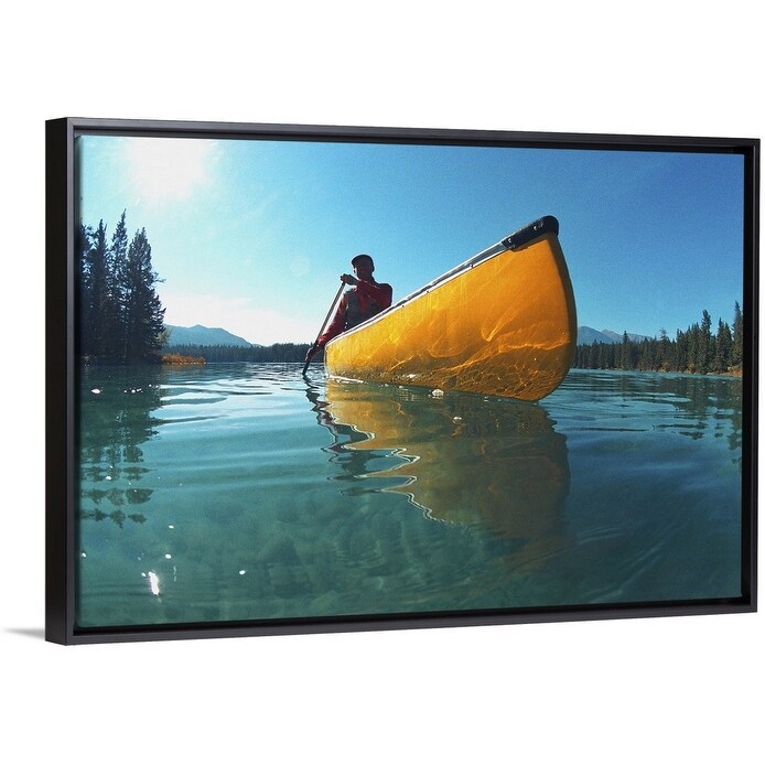 Shop Man In Yellow Canoe On Lake Black Float Frame Canvas Art
