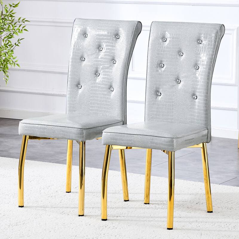 A set of 2 vintage crocodile leather cushioned dining chairs, featuring crystal clasp design and artificial leather design